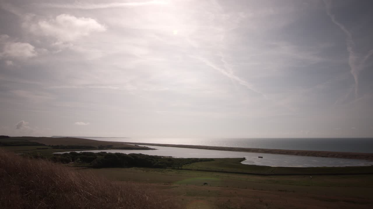 Coastal Landscape with Lake and Cloudy Sky