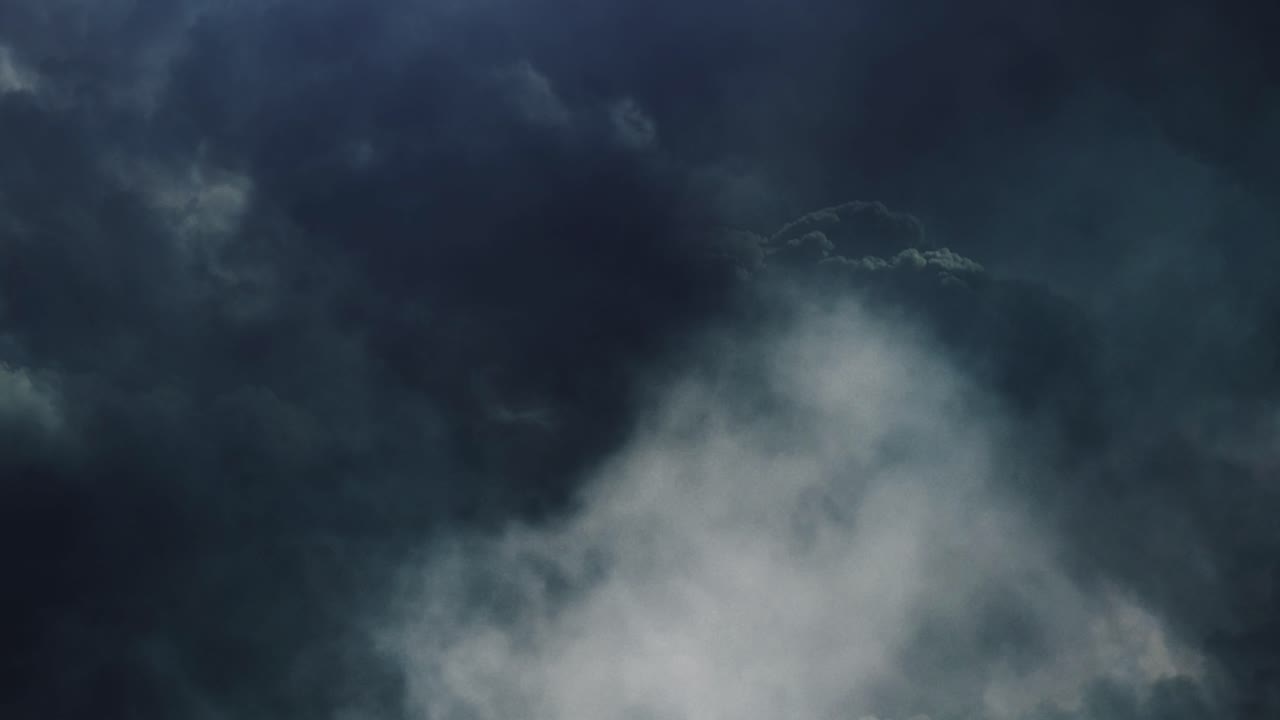 4k thunderstorm, flying through dark cumulonimbus clouds in the sky