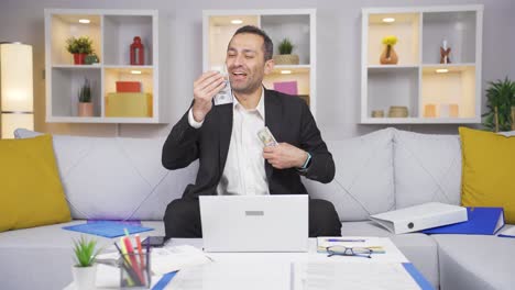 home office worker man is stingy and loves money.
