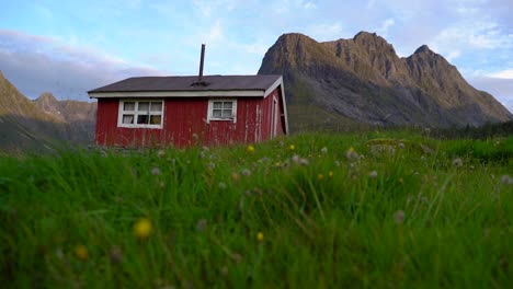 a red small house in the mountains-1