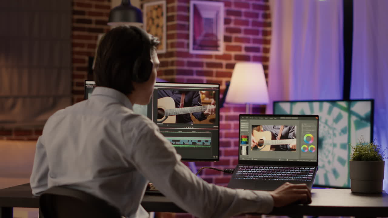 Video editor working on color correction of a music performance