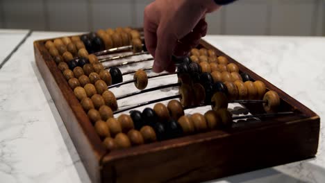 vintage abacus with hand