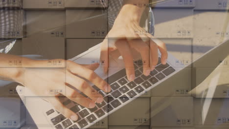 animation of man typing on laptop keyboard with stacks of boxes in background