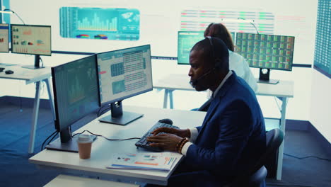 general director examining statistics big data on computer in a control room