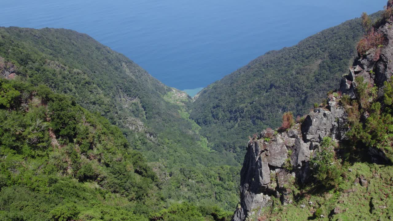 Aerial View of a Mountain Valley and Ocean Coastline