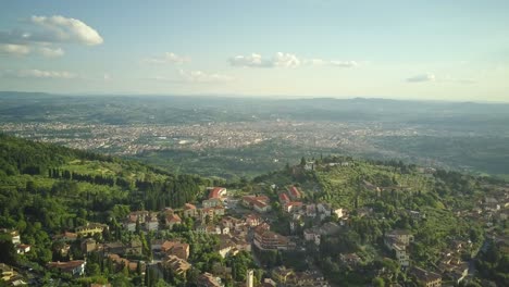 panoramic aerial shot over florence with fiesole in the foreground in 4k