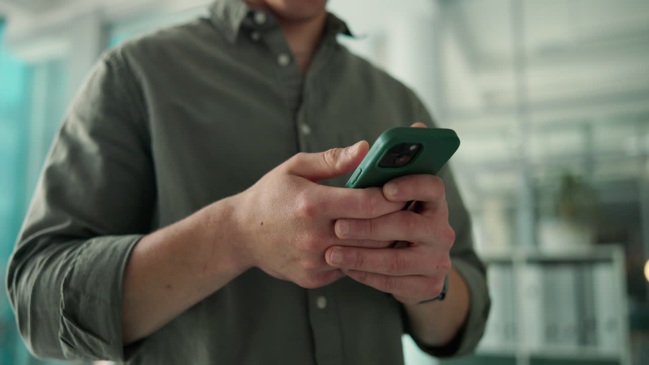 Close Up of Man's Hands Using a Smartphone