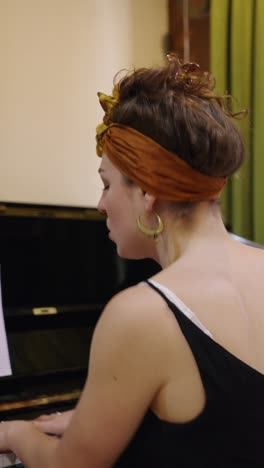 woman singing and playing piano