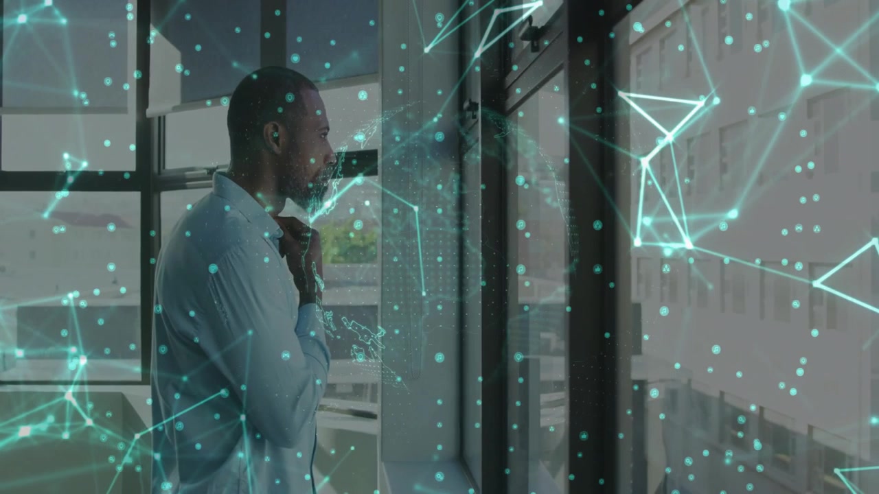 Businessman standing in office holding chin initiating data overlay rotating map analyzing network
