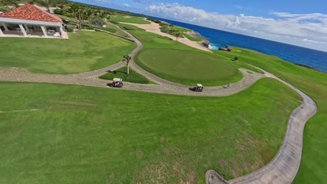 drone fpv shot of los corales golf course with ocean views, punta cana