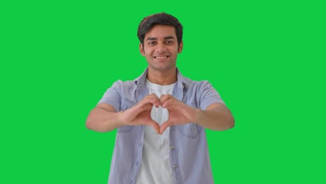 Cute-Indian-boy-showing-heart-sign-Green-screen
