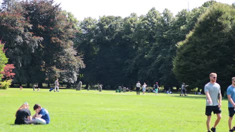 people enjoying a sunny day in cardiff park