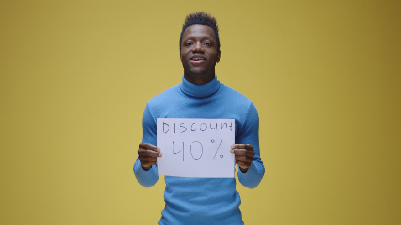 Happy Man Holding 'Discount 40%' Sign