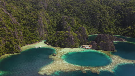 twin lagoon with natural rock formations in summer in palawan, philippines. - aerial shot