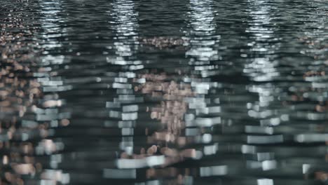 Water-surface-with-lights-reflection-at-night