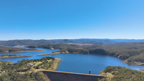 flying above the steep walls of queensland's cania dam and the headlands of three moon creek, cottages and, rich national park forests, monto, burnett region, queensland, australia.