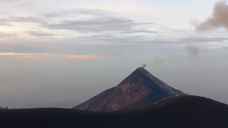 aerial view of volcan fuego eruption at sunrise, drone flying forwards 4k