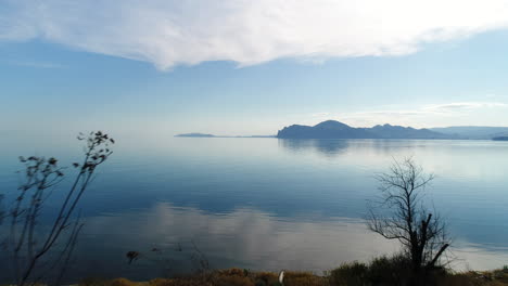 coastal landscape with calm water and mountains