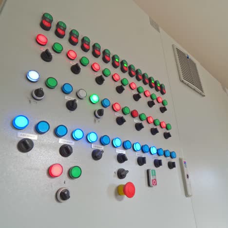 automated panel with glowing buttons. control buttons inside the modern industrial plant. industrial equipment indoors