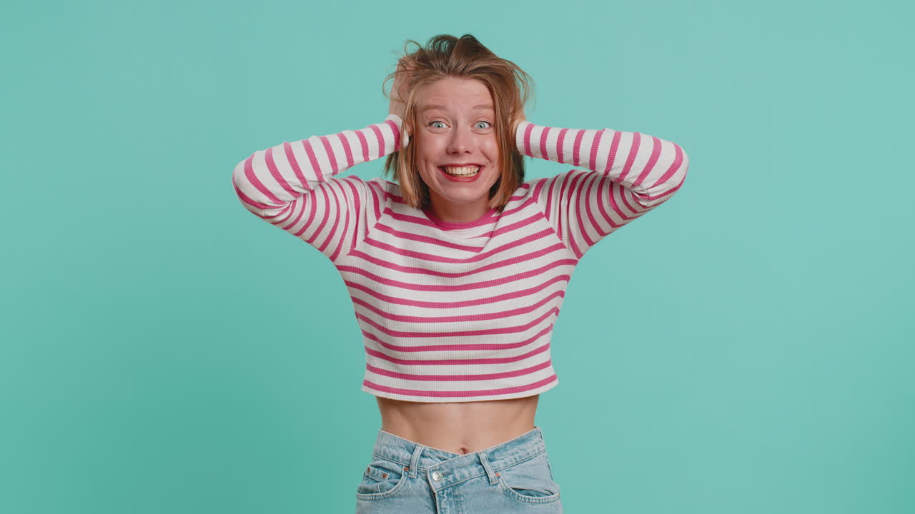 Excited amazed woman surprise looking at camera with big eyes shocked by sudden victory wow emotion