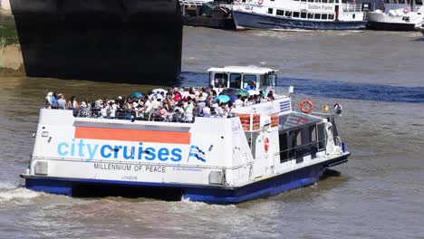 tourist boat cruising on the thames river