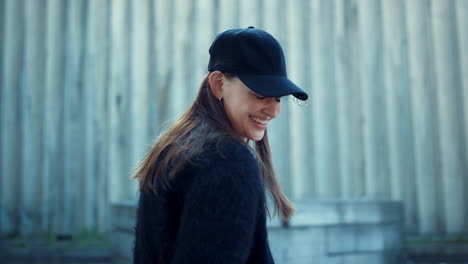 Girl-posing-at-camera-on-urban-street.-Closeup-stylish-woman-laughing-outside