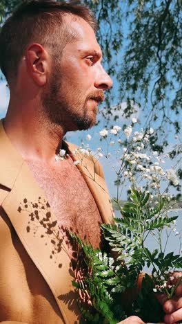 man in beige blazer with flowers