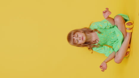 child girl kid breathes deeply eyes closed, meditating relaxing, taking a break, rest, peaceful mind