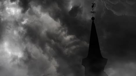 the top of the church roof against a background of storm clouds