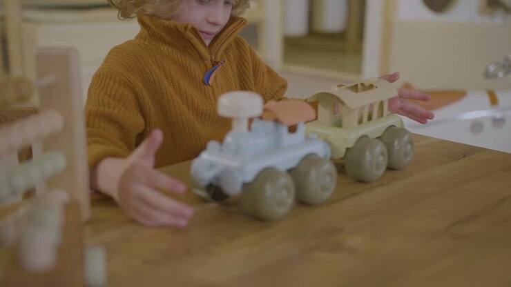 Little boy playing with eco toy