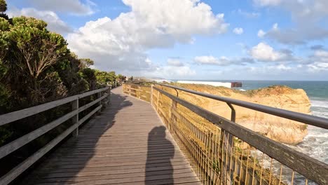 wooden path with ocean and cliff views