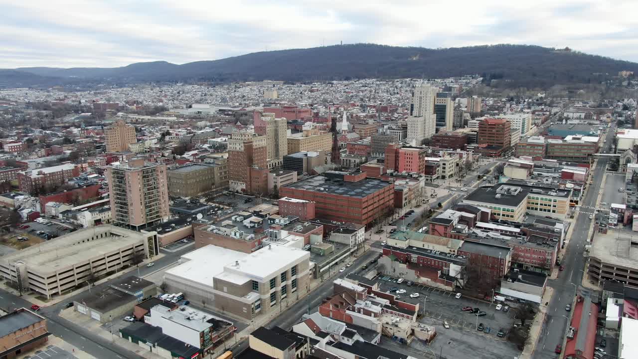 City of Reading, PA, aerial pullback reveals downtown financial district and sprawling residential urban neighborhoods