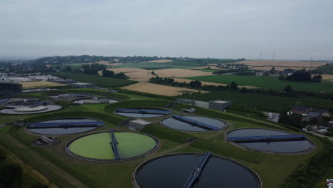 aerial view of a wastewater treatment plant surrounded by agricultural land