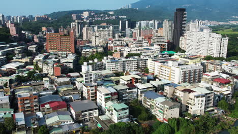 drone view of guandu's skyline and hills in taipei, taiwan