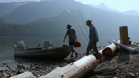 Two-fishermen-preparing-for-fishing-at-countryside-4k