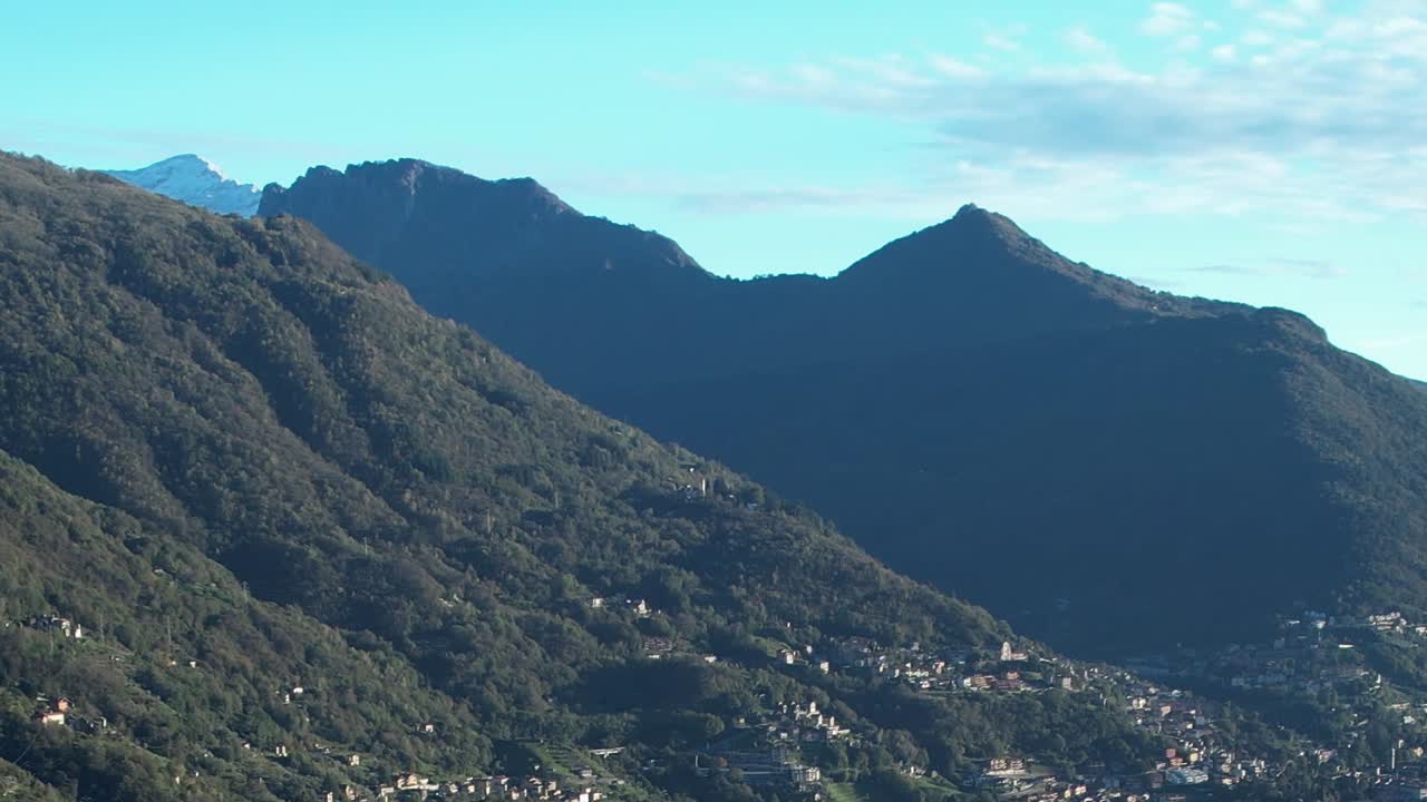 Aerial view of lush green Alps in Italy during clear weather