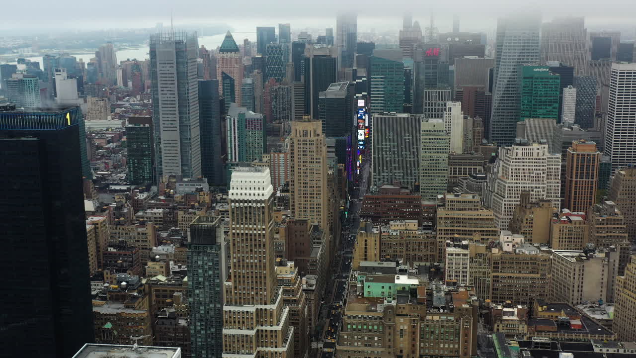 Drone flying toward the Times square, misty day in Manhattan, New York, USA