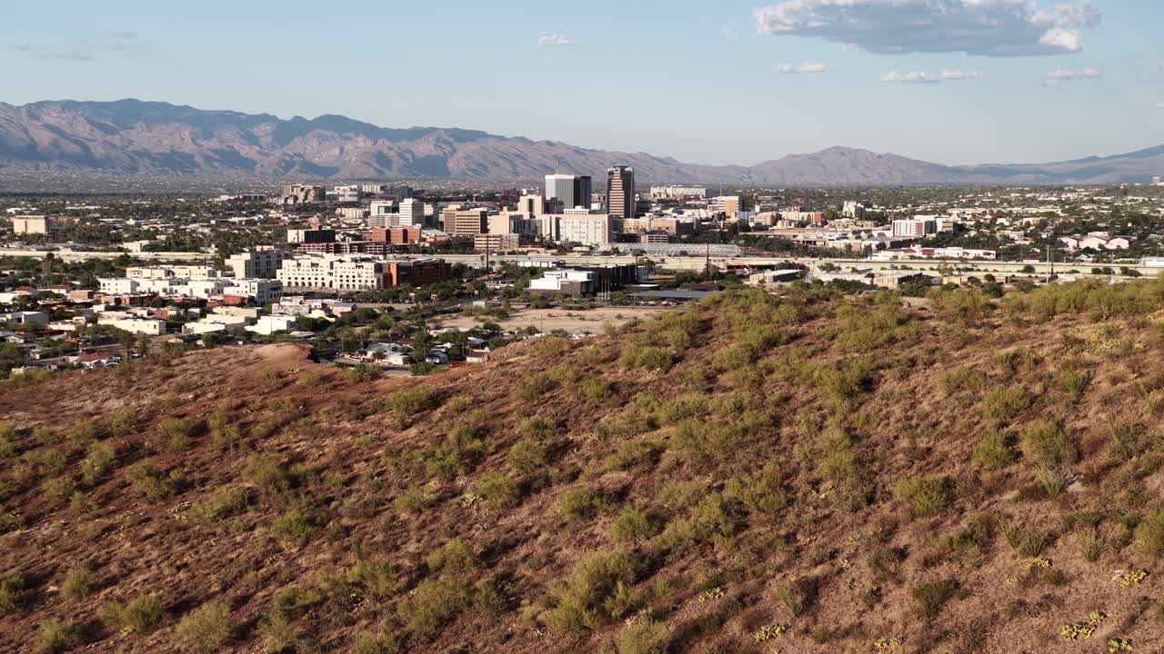 Drone ascending over Sentinel Peak to reveal downtown Tucson, Arizona