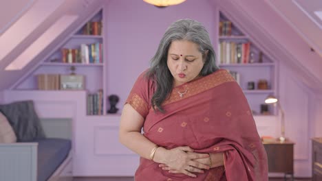 Sick-Indian-old-woman-suffering-from-stomach-pain