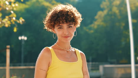 woman in a yellow top outdoors