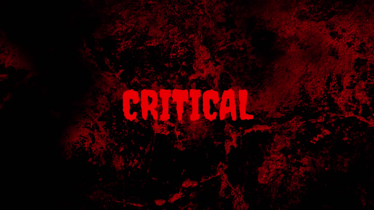 Red Critical Text Flashing on Dark Grunge Background