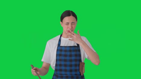 indian housewife tasting spicy food green screen