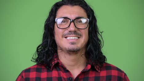 handsome hipster man smiling while wearing eyeglasses