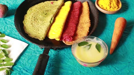 dosa in different colors on blue  background