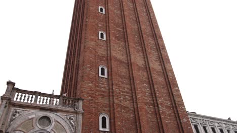 st marks campanile belltower in venice italy on grey foggy sky day