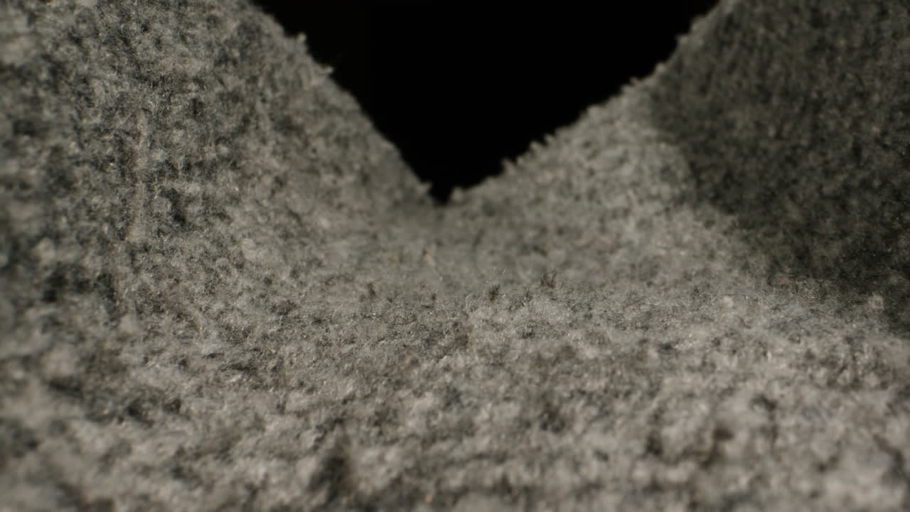 Wool textile cloth texture close-up macro. Woolen background. Fashion fabric multicolor. Sheep wool for clothes