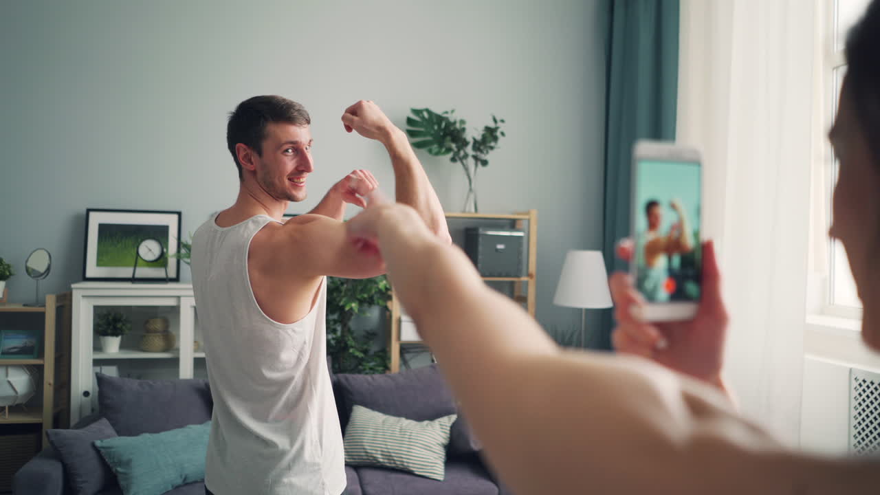 Man taking a selfie while showing off biceps