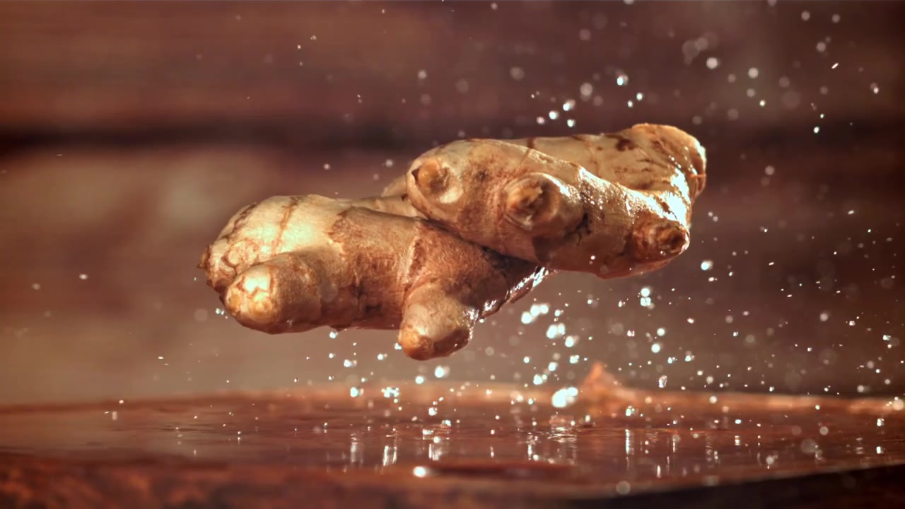 Ginger Root Falling and Splashing Water in Slow Motion