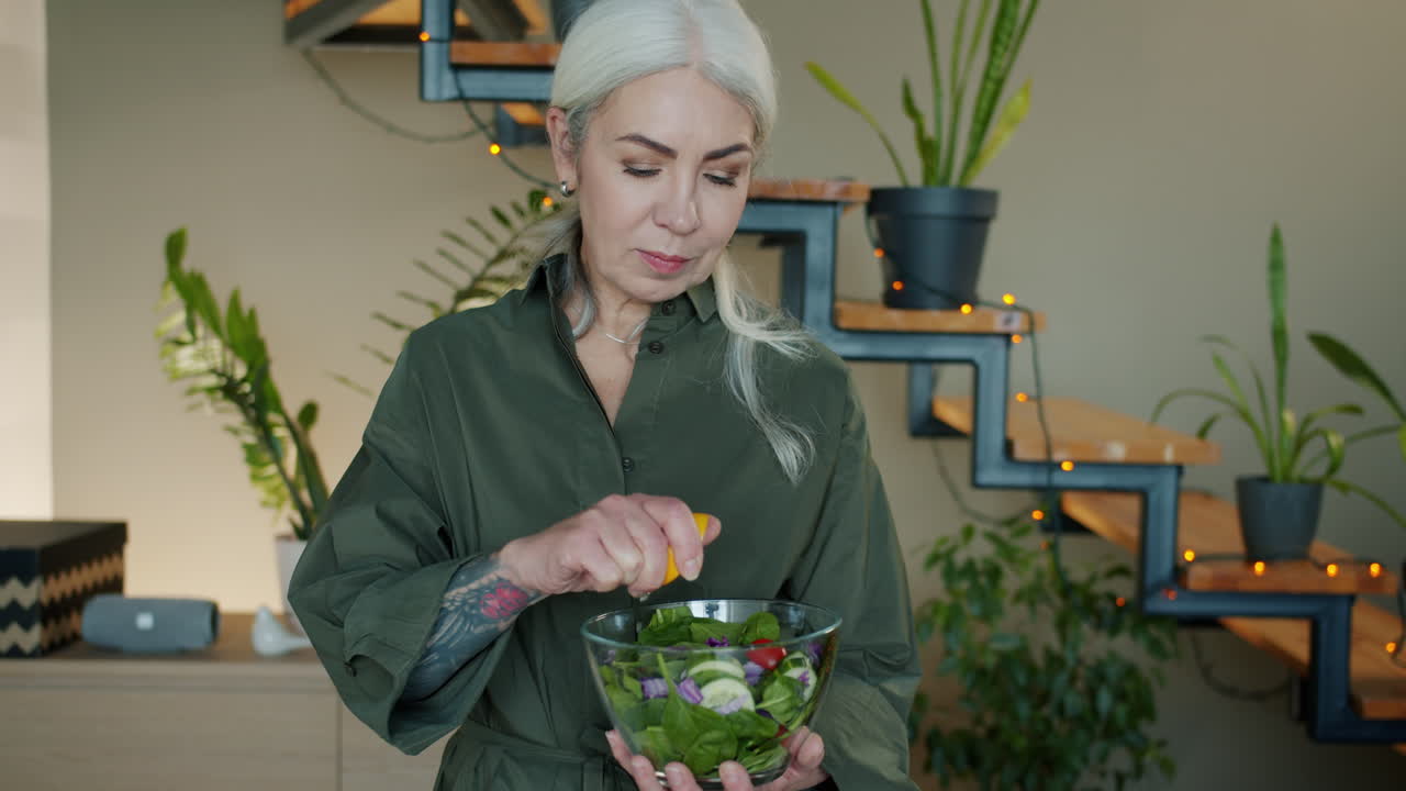 Senior Woman Preparing a Healthy Salad at Home