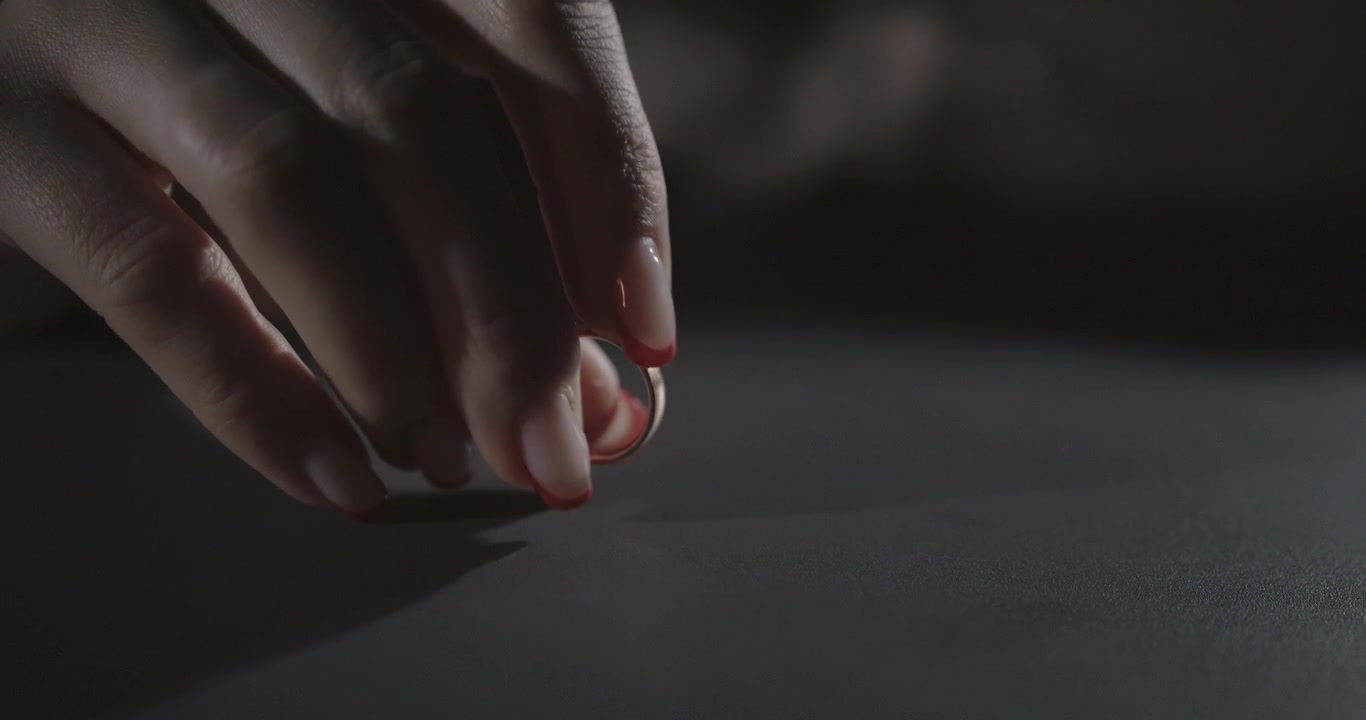 woman plays with wedding ring